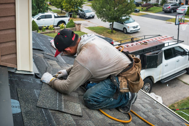 Professional Roofing technician working in Granby, MA